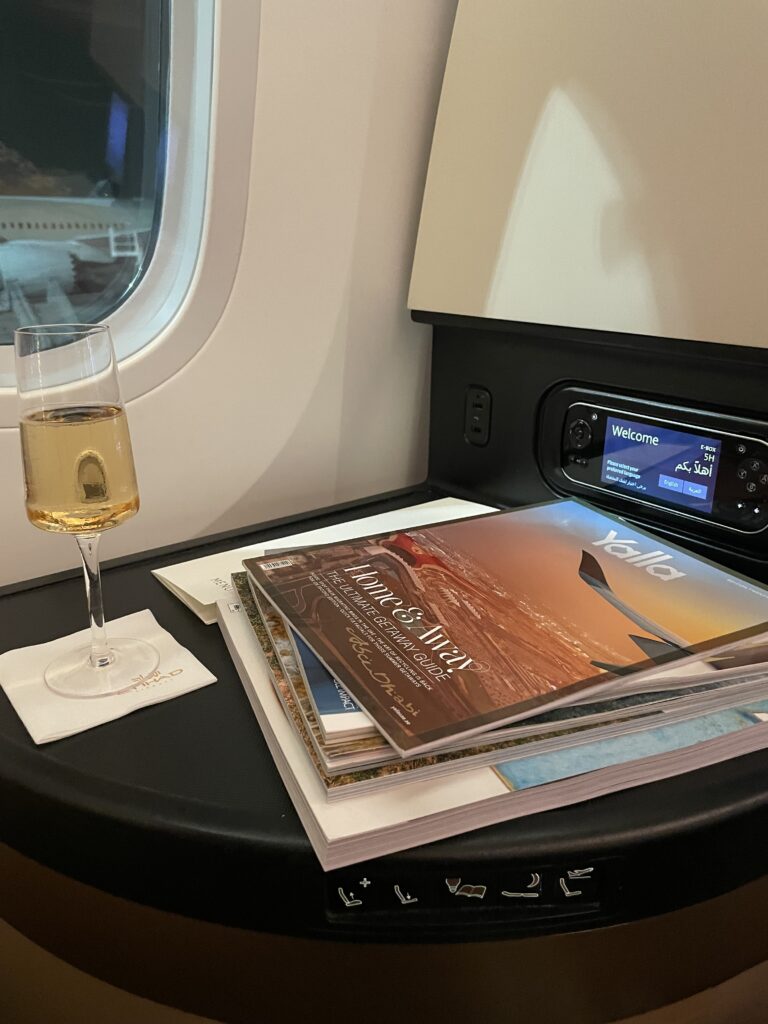 Welcome Champagne and magazines onboard Etihad Business Class Boeing 787-9