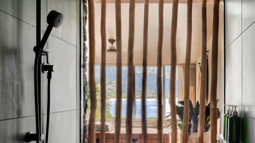 View from inside shower out to room and window with view, 1 hotel Hanalei bay
